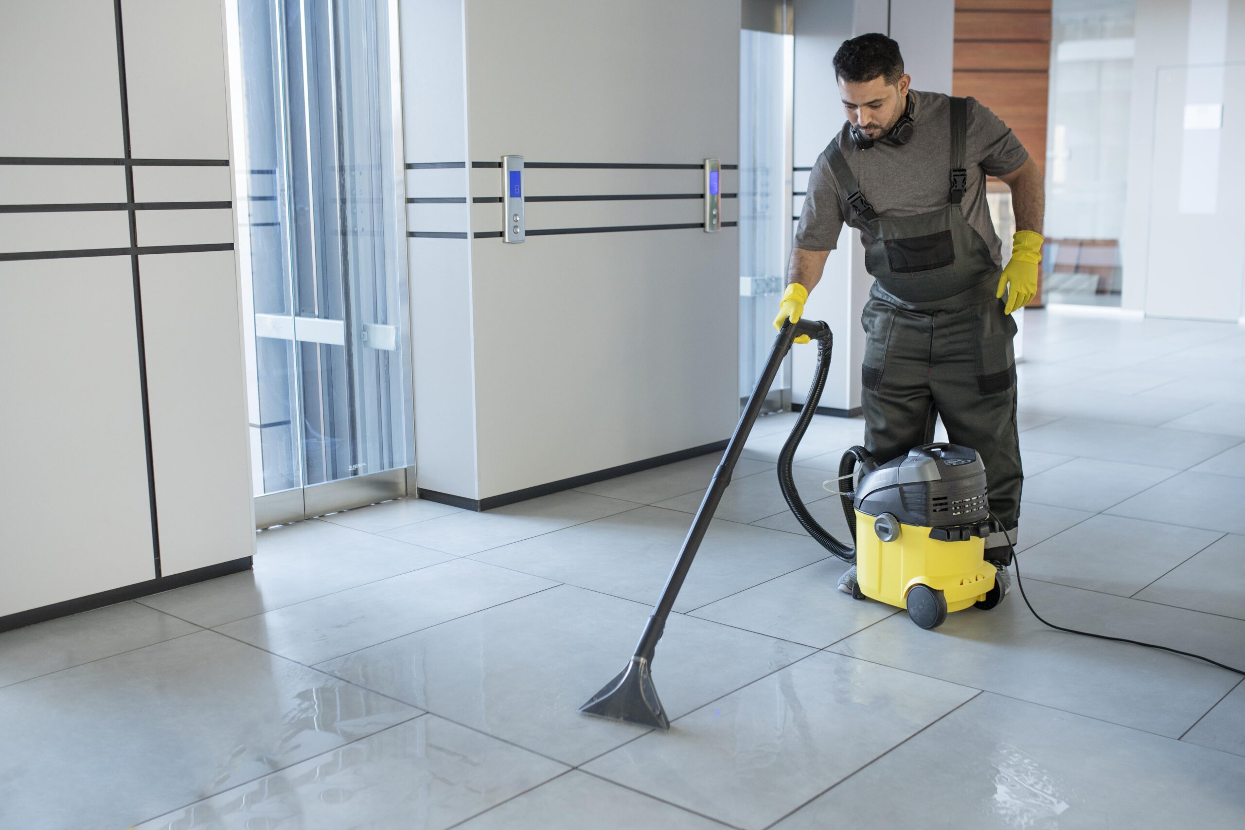 Fraser Commercial Services cleaner performing nightly janitorial floor care